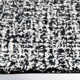 Britley Handmade Tufted Wool Black/White Area Rug
