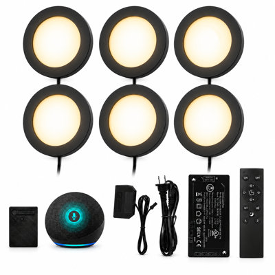 Set of six black circular LED puck lights with power supply, cables, smart voice assistant, and two remote controls.