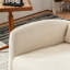 Chaise berçante avec repose-pieds et dossier haut, en bois d'hévéa et rembourrée pour une expérience d'assise confortable.