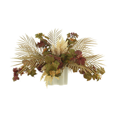 Centre de table en mélange de fleurs dans un vase en céramique