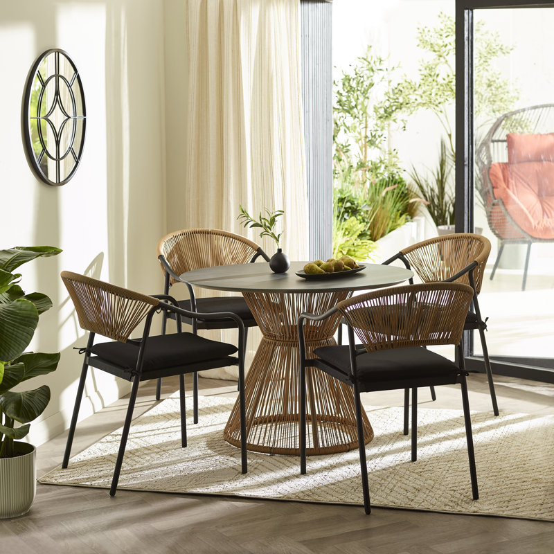 Halleli 4 - Person Acacia Wicker Patio Dining Set with Round Table , Cushions Included, Black