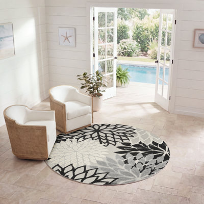 Tapis intérieur / extérieur noir / gris / blanc à motif floral Arnelle