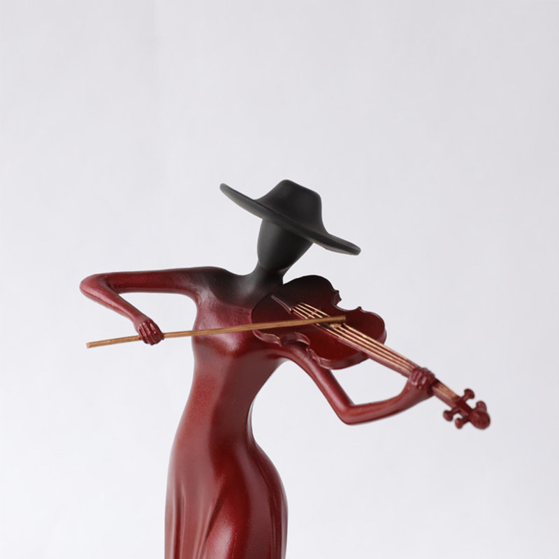 Objet décoratif en métal en forme de femme rouge avec marbre
