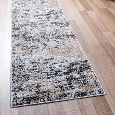 Tapis abstrait en polypropylène tissé à la machine Highdell en brun / noir / blanc