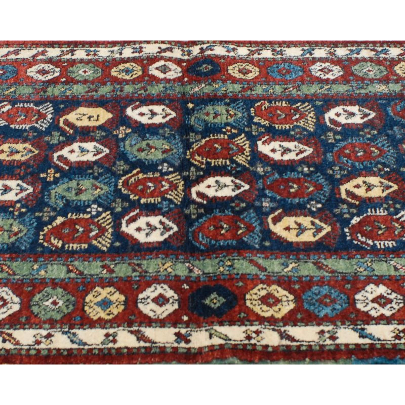 Seychour Wool Oriental Area Rug in Green/Red