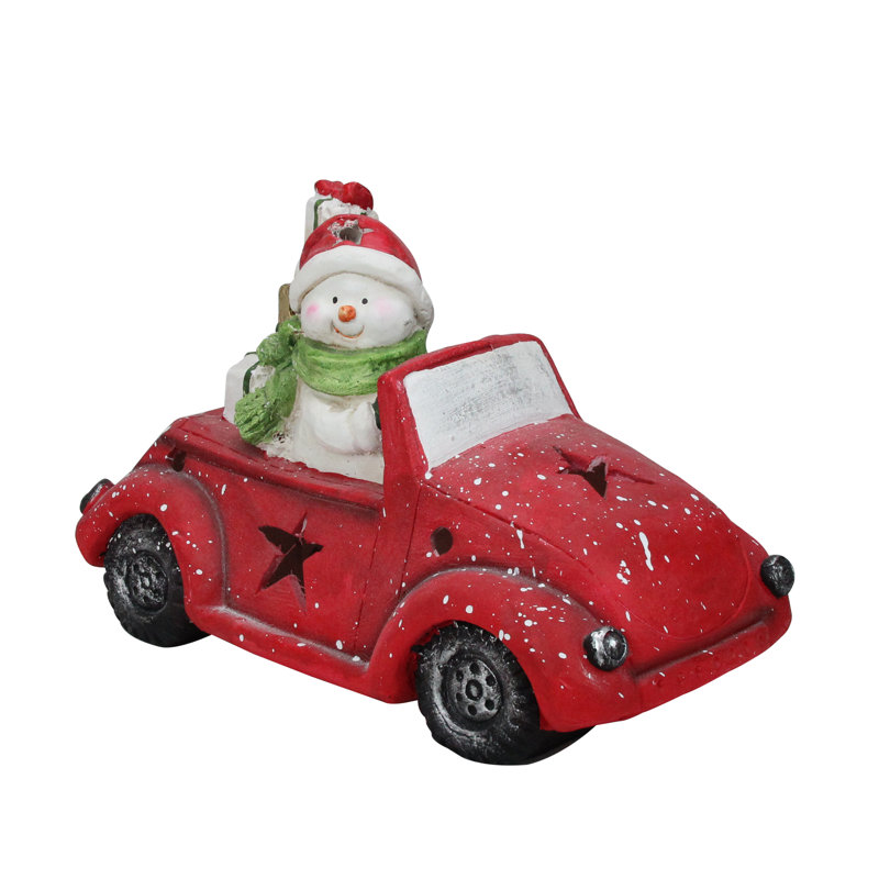 Joyeux bonhomme de neige à DEL pré-éclairé au volant d'une voiture étoile rouge