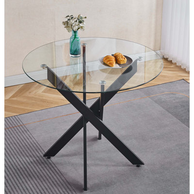 Table de salle à manger avec pieds en métal et verre trempé