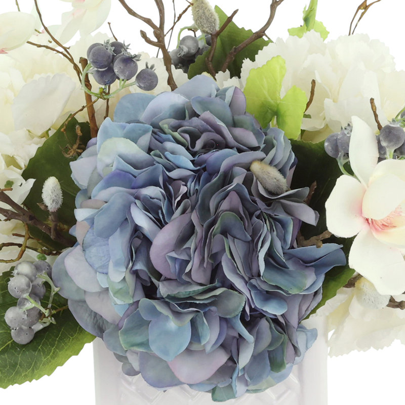 Hydrangea, Berris and Magnolia Arranged in a Ceramic Pot