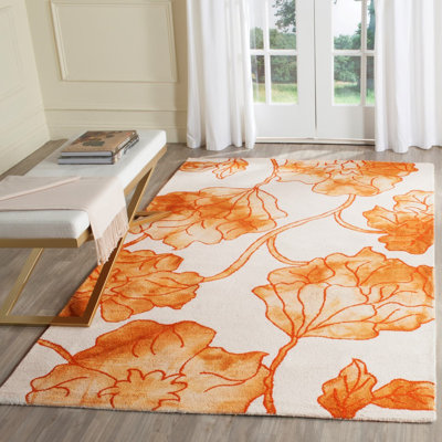 Tapis floral ivoire / orange en laine / coton touffeté à la main Coleman