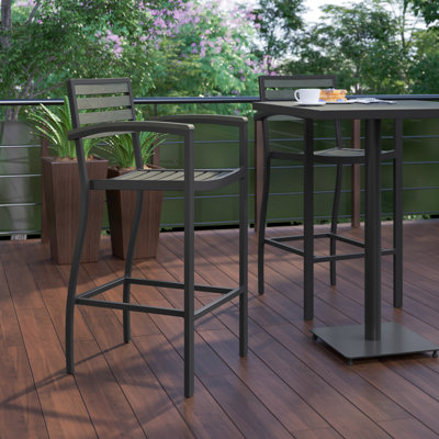 Clarie Commercial Grade Outdoor Bar Stool with Armrests and Poly Resin Slats by Wildon Home