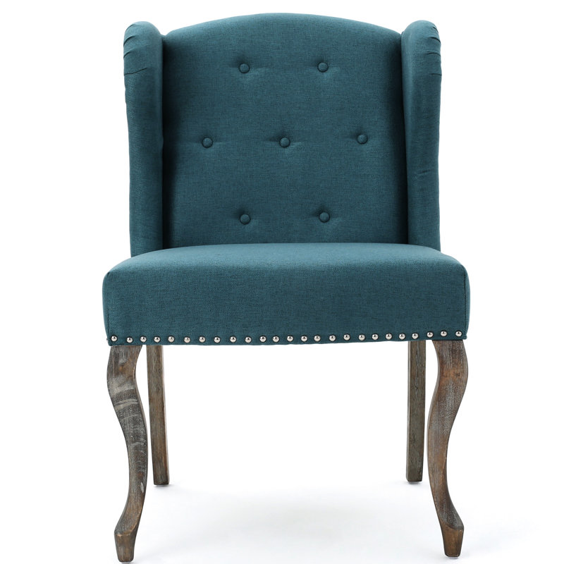 Fauteuil à oreilles bleu sarcelle avec garniture cloutée et boutons
