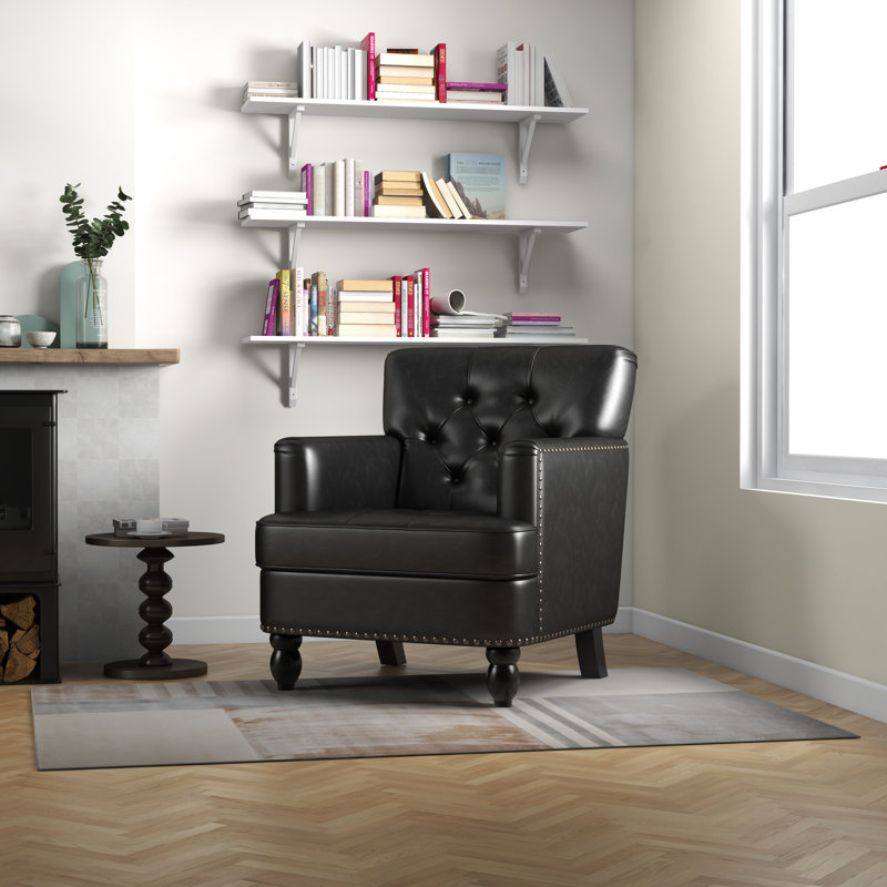 Chaise de salon confortable en noir avec matériaux de fabrication club et coussin moelleux