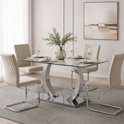 Table de salle à manger 63 x 35,4 x 30 pouces en verre transparent - un mélange parfait de durabilité et d'élégance. Plateau de table en verre trempé transparent, pieds de table en acier inoxydable argentés.