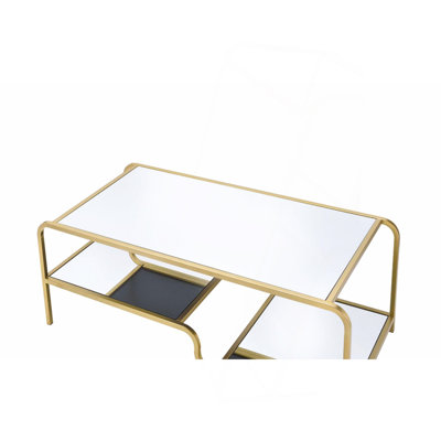 Table basse à miroir et finition dorée