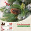 Arbre de Noël artificiel givré avec baies rouges et pomme de pin-290985648