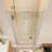 Space-Saving Bi-Fold Frameless Shower Door With Sleek Chrome Finish & Clear Glass-122567697