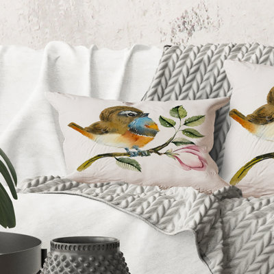 Coussin rectangulaire à motif d'oiseaux bleus sur une branche