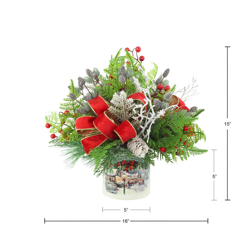 Festive holiday arrangement with greens and Berries