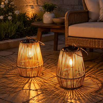Waterproof outdoor solar LED lanterns in a 2 Pack provide decorative lighting for gardens, yards, patios, and porches and are suited as gifts for women, Mom, or Grandma.