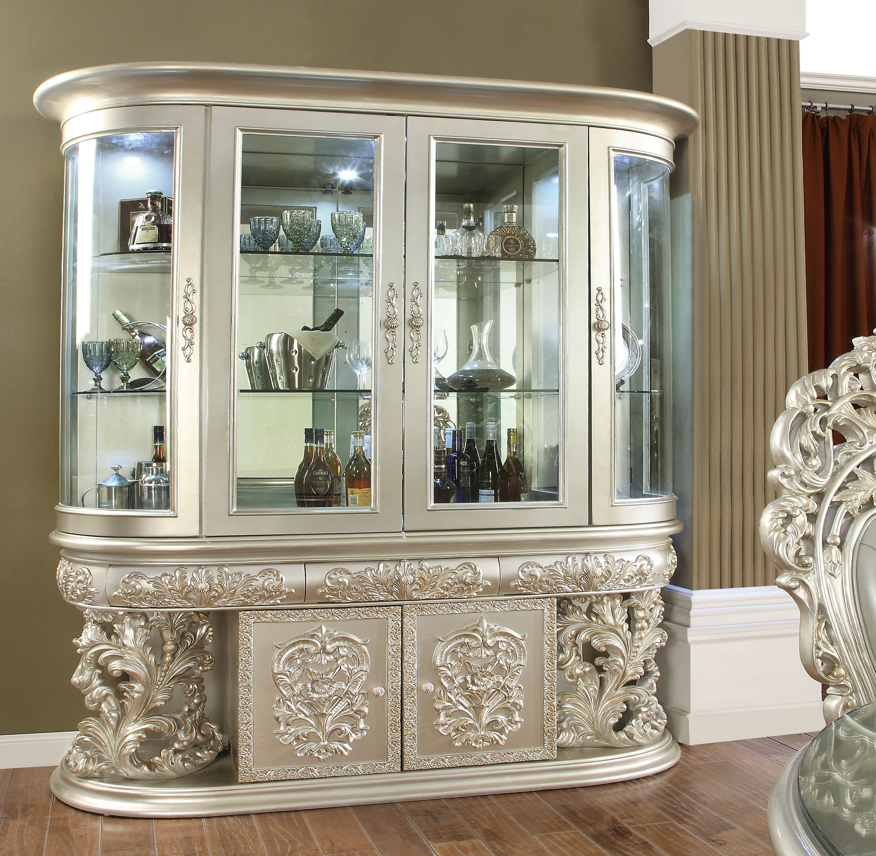 https://assets.wfcdn.com/im/85134138/compr-r85/2465/246583259/766-wide-curio-cabinet-with-glass-shelf-in-champagne.jpg