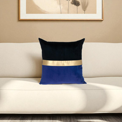 This velvet pillow measures features a color block design