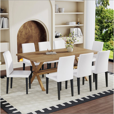 Ensemble de table et de chaises. Bureau de 71 po x 35,4 po en bois aggloméré avec table de salle à manger en X. Comprend 8 chaises de salle à manger en polyuréthane avec pieds en métal, ce qui en fait un choix idéal pour la maison.