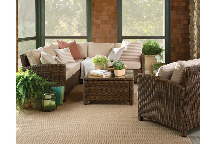 Bright sunroom with wicker lounge furniture