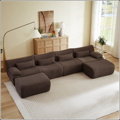 Canapé d'angle convertible en forme de U avec pouf pour un confort optimal et une modularité parfaite dans votre salon