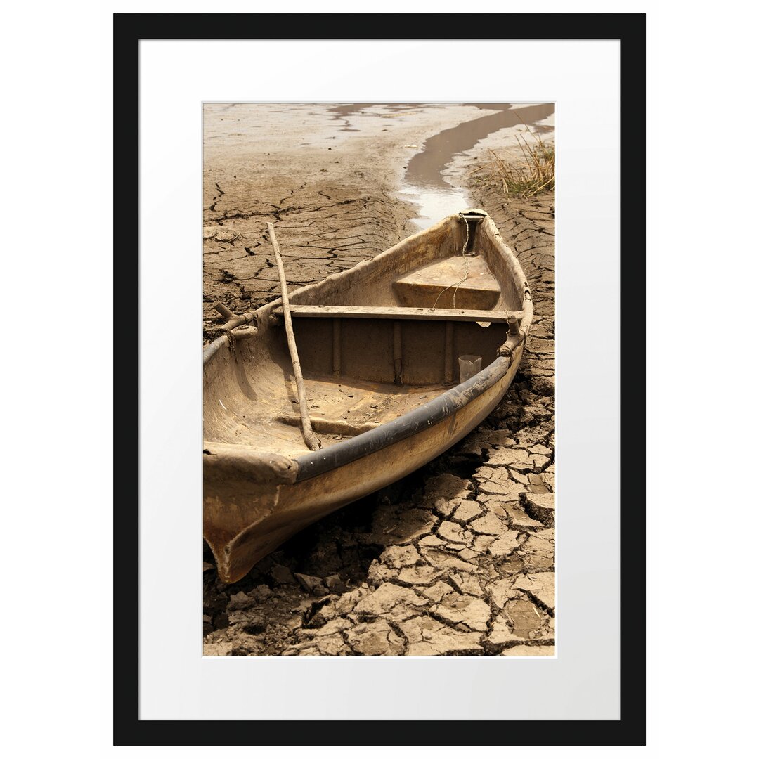 Gerahmter Fotodruck Boat in a Dried-Up Lake