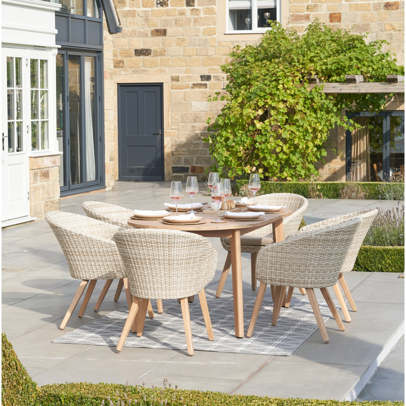 Cambrai 6 - Person Acacia Premium All-Weather Wicker Patio Dining Set with Oval Table