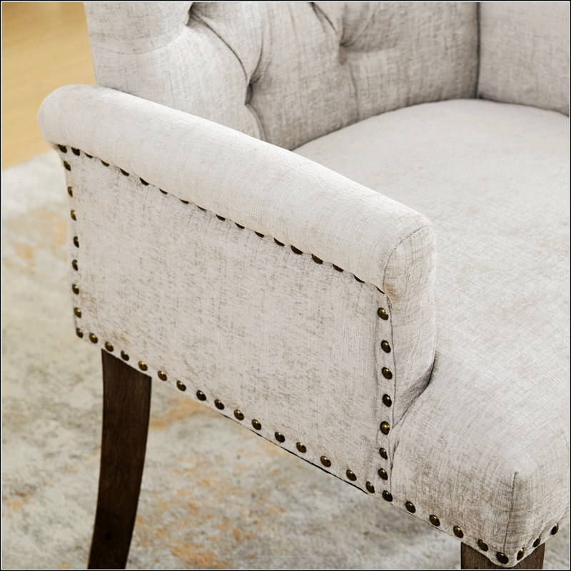 Élégante chaise de salle à manger rembourrée en chenille avec des pieds incurvés en bois massif, parfaite pour le confort et le style dans toute salle à manger.