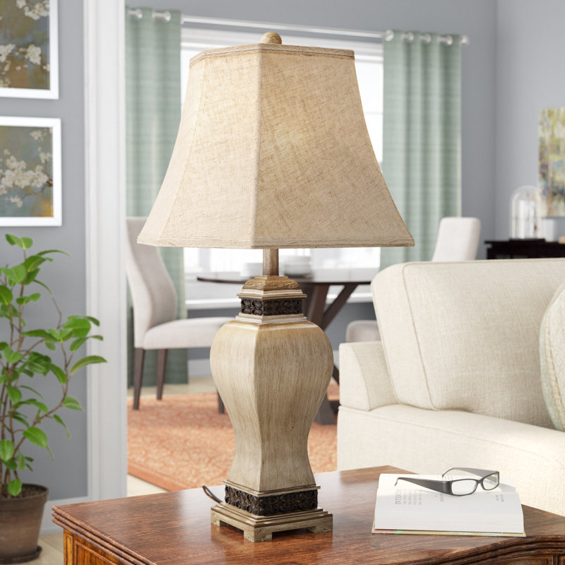 Brown Polystone Scroll Carved Room Table Lamp with Black Accents and Tapered Shade