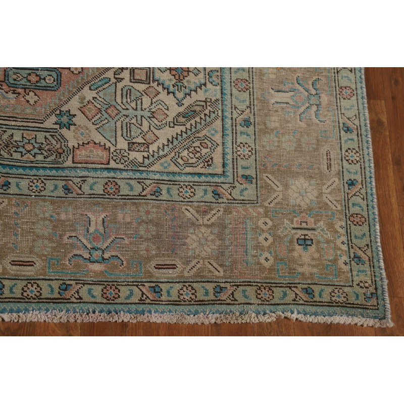 Tapis traditionnel rose en laine patiné 7 x 9