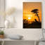 Silhouette de famille de lion contre un coucher de soleil orange, art mural sur toile-132739048