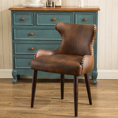 Fauteuil demi-tonneau capitonné à dossier capitonné