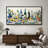 Framed canvas wall art with a Mediterranean still life painting of a dining table, displayed above a dark wood sideboard.