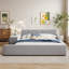 Lit tapissier en velours avec bureau de chevet et petit tabouret rond-811936897-811936899
