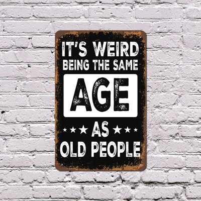 It’s Weird Being The Same Age As Old People 11 Inch x 17 Inch Plastic Sign Still Young At Heart Durable Weatherproof Perfect for Living Rooms Garages Offices Fun Gift for Friends Coworkers Parents
