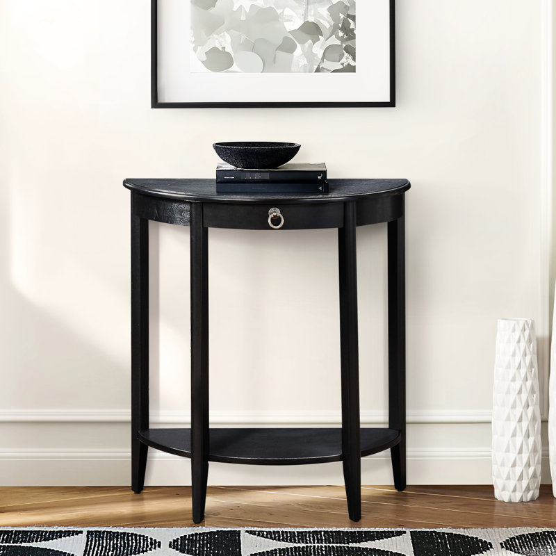 Console en demi-lune au fini noir avec compartiment ouvert sur l'étagère inférieure, plateau en bois massif, 4 pieds carrés en pin massif, 1 tiroir, différence de hauteur de 49,3 cm entre le plateau et la poignée de 12,7 cm.