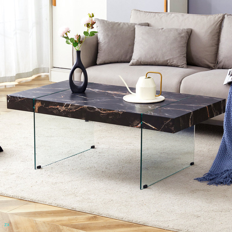 Table basse de 43,3 po x 23,6 po en MDF à motif de marbre avec pieds en verre trempé. Convient au salon. Elle peut être utilisée non seulement comme table basse, mais aussi comme table d'appoint ou présentoir.