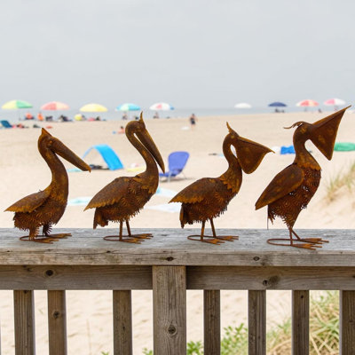 Set of 4 Assorted Style Rust-Colored Pelican Figurines
