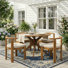 Cagnie Scandinavian Minimalist Acacia Wood Outdoor Dining Set With Armless Cushioned Chairs And Round Slat Table