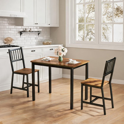 Ensemble de table et de chaises gain de place avec structure en acier, idéal pour la cuisine ou le coin repas.