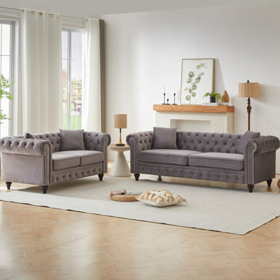 5 sièges modernes en velours gris, avec structure en pin massif et 4 coussins avec accoudoirs roulés, boutons et structure