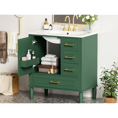 Meuble de salle de bain de 76 cm avec trois tiroirs, portes à fermeture amortie, lavabo en céramique, poignées dorées, rangement compact, espace de bain optimisé