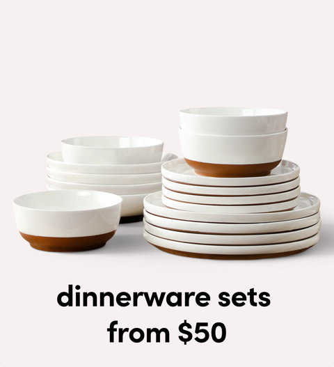 Stack of white dinnerware plates and bowls.