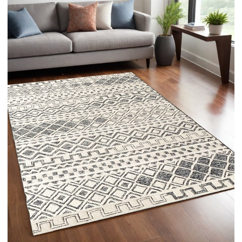 Tapis géométrique abstrait en laine touffeté à la main noir et ivoire 5 pi x 8 pi