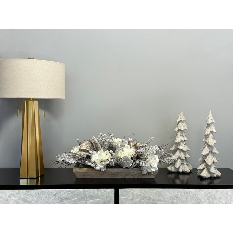 Holiday Centerpiece With Hydrangeas, Snow Covered Pines, And Music Bow