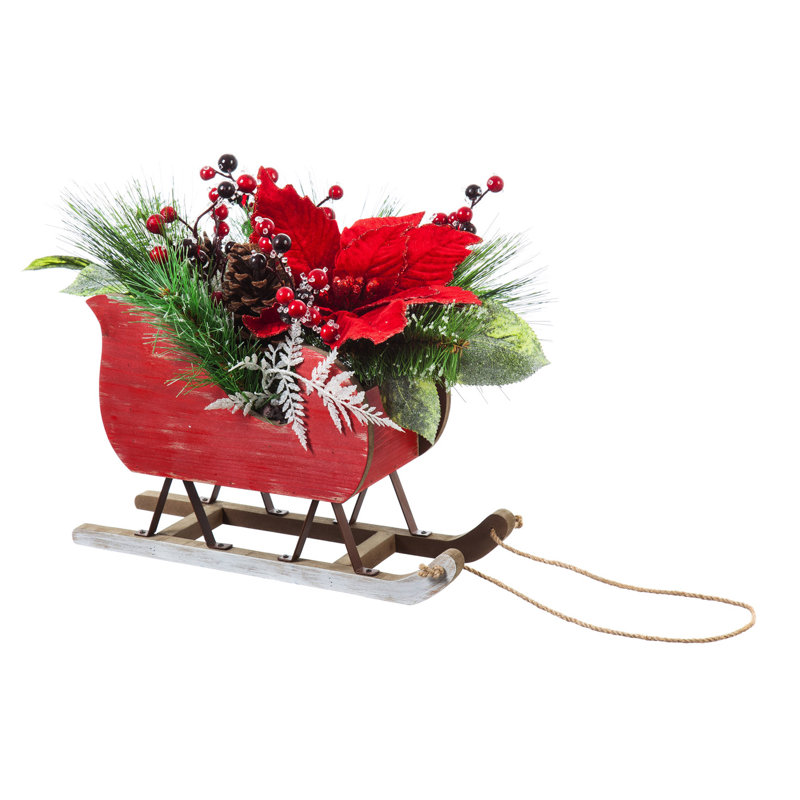 Décoration de table poinsettia et baies sur une table de chariot