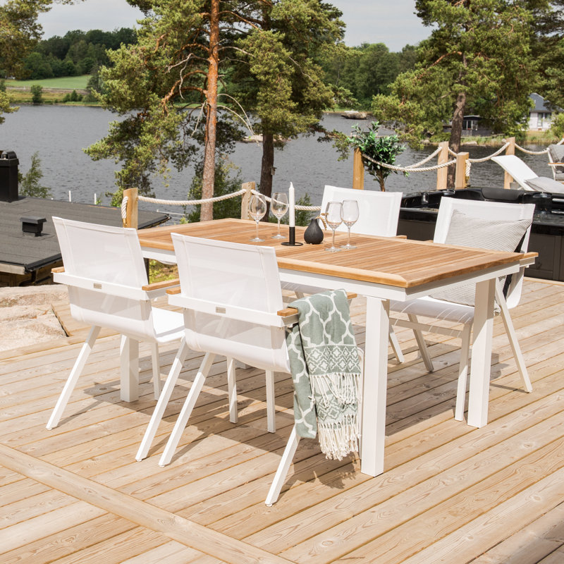 Navya 4 - Person Teak Solid Wood Patio Dining Set Extendable Rectangular Table